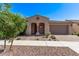 Charming home featuring a beautiful tiled roof, stucco exterior, and landscaped front yard, enhancing its curb appeal at 10311 E Trent Ave, Mesa, AZ 85212