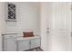 Mud room featuring a wine rack, shiplap wall, bench seat, and gray storage cabinets at 10311 E Trent Ave, Mesa, AZ 85212