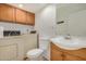 Bathroom featuring a vanity, toilet, washer and dryer at 1052 S San Jose St # 6, Mesa, AZ 85202