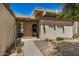 Inviting front entrance featuring a brown door, glass sidelights, and well-maintained landscaping at 1052 S San Jose St # 6, Mesa, AZ 85202
