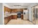 Modern kitchen featuring stainless steel appliances, granite countertops, and tiled flooring at 1052 S San Jose St # 6, Mesa, AZ 85202