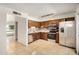 Well-lit kitchen featuring stainless steel appliances and wood cabinetry at 1052 S San Jose St # 6, Mesa, AZ 85202