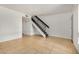 Living room with tiled floor and staircase with dark rails at 1052 S San Jose St # 6, Mesa, AZ 85202