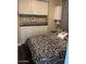 Comfortable bedroom with built-in storage and stylish black and white bedding at 111 S Greenfield Rd # 785, Mesa, AZ 85206