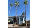 Charming home with tall palm trees, carport, and well-maintained landscaping at 111 S Greenfield Rd # 785, Mesa, AZ 85206