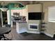 Bright kitchen with white cabinetry, stainless steel appliances, and breakfast bar at 111 S Greenfield Rd # 785, Mesa, AZ 85206