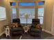 Cozy living room features two leather recliners and bright natural light at 111 S Greenfield Rd # 785, Mesa, AZ 85206