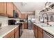 Functional kitchen boasts modern appliances, ample counter space, and wooden cabinets at 13159 W Caribbean Ln, Surprise, AZ 85379