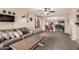 Comfortable living room area offers a view into the kitchen and dining nook at 13159 W Caribbean Ln, Surprise, AZ 85379