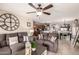 Open-concept living room connects to the kitchen and dining area for easy entertaining at 13159 W Caribbean Ln, Surprise, AZ 85379