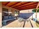 Covered patio with outdoor seating, perfect for enjoying fresh air and relaxation in a private space at 13159 W Caribbean Ln, Surprise, AZ 85379