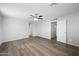 Spacious bedroom with modern flooring, ceiling fan, and ample natural light at 13261 W Gelding W Cir, Surprise, AZ 85379