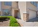 Charming front entrance with a security door, stone accents, and manicured landscaping, enhancing curb appeal at 13261 W Gelding W Cir, Surprise, AZ 85379