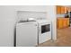 Laundry room with included washer and dryer, and access to the kitchen area at 13261 W Gelding W Cir, Surprise, AZ 85379
