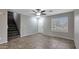 Bright, tiled living room with stairs and a window at 13261 W Gelding W Cir, Surprise, AZ 85379