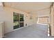 Covered patio with sliding glass doors overlooking the backyard, perfect for outdoor entertaining at 13261 W Gelding W Cir, Surprise, AZ 85379