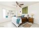 Bright bedroom features a cozy window seat, large windows, and a ceiling fan for comfort at 14300 W Bell Rd # 222, Surprise, AZ 85374