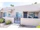 Charming gated front patio with seating area for outdoor relaxation and curb appeal at 14300 W Bell Rd # 222, Surprise, AZ 85374