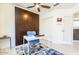 Well-lit home office boasts a built-in cabinet and plenty of space for work and creativity at 14300 W Bell Rd # 222, Surprise, AZ 85374