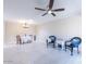 Spacious living room with modern flooring, ceiling fan, and dining area at 14300 W Bell Rd # 222, Surprise, AZ 85374