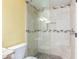 Tiled shower with pebble floor and glass door in this bathroom with a granite countertop vanity at 145 N 74Th St # 240, Mesa, AZ 85207