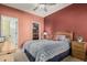 Charming bedroom with a patterned bedspread, wooden headboard, and a closet with shelving at 145 N 74Th St # 240, Mesa, AZ 85207