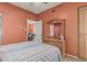 Bedroom with dresser, and view to open doorway at 145 N 74Th St # 240, Mesa, AZ 85207