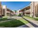 Community gathering space with seating, green lawns, and mature landscaping at 145 N 74Th St # 240, Mesa, AZ 85207