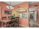 Cozy dining area featuring a wooden table, ornate chairs, and an open view into the kitchen at 145 N 74Th St # 240, Mesa, AZ 85207