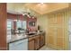 Kitchen view with black sink, granite countertops, and dining area at 145 N 74Th St # 240, Mesa, AZ 85207