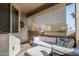 Comfortable outdoor patio features a cushioned sofa, sunshade, and stylish decor elements at 145 N 74Th St # 240, Mesa, AZ 85207