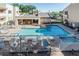Resort-style swimming pool with a sun deck and comfortable lounge chairs for relaxation at 145 N 74Th St # 240, Mesa, AZ 85207