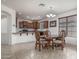 Charming dining area with a chandelier and kitchen access, perfect for entertaining at 15140 W Glenrosa Ave, Goodyear, AZ 85395