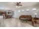 Open-concept space with tile floors, a dining area, and a kitchen view at 15140 W Glenrosa Ave, Goodyear, AZ 85395