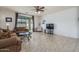 Comfortable living room with tile floors, neutral colors, and outdoor views at 15140 W Glenrosa Ave, Goodyear, AZ 85395