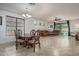 Spacious living room featuring a dining area, tile flooring, and natural light at 15140 W Glenrosa Ave, Goodyear, AZ 85395