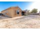View of the back of the house including the covered patio and backyard at 16600 W Washington St, Goodyear, AZ 85338