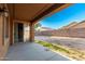 A covered patio with a sliding glass door overlooks the expansive yard ready for customization at 16600 W Washington St, Goodyear, AZ 85338