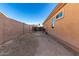 Large backyard featuring block wall fencing, an open patio and space for personalization at 16600 W Washington St, Goodyear, AZ 85338
