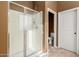 Bathroom featuring a glass enclosed shower and a separate water closet at 16600 W Washington St, Goodyear, AZ 85338