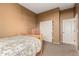 Bedroom with neutral carpet, one window, and a sliding closet at 16600 W Washington St, Goodyear, AZ 85338