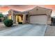 Attractive home with a well-kept yard, two car garage and inviting entryway at 16600 W Washington St, Goodyear, AZ 85338