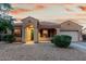 Charming single-story home with a well-maintained front yard and appealing facade at 16600 W Washington St, Goodyear, AZ 85338