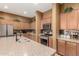 Well-equipped kitchen featuring stainless steel appliances, granite countertops, and plenty of cabinet space at 16600 W Washington St, Goodyear, AZ 85338