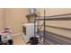 Well-organized laundry room featuring a washer, dryer, shelving and storage solutions at 16600 W Washington St, Goodyear, AZ 85338