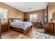Spacious main bedroom featuring hardwood floors, abundant natural light, and a dedicated work area at 16600 W Washington St, Goodyear, AZ 85338