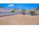 Large backyard with desert landscaping offering a blank canvas for outdoor activities and personalization at 1811 E Tierra Buena Ln, Phoenix, AZ 85022