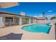 Backyard featuring a sparkling pool, covered patio, and ample space for outdoor entertaining at 1811 E Tierra Buena Ln, Phoenix, AZ 85022