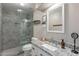Modern bathroom features a sleek glass shower, granite vanity, and stylish fixtures at 1811 E Tierra Buena Ln, Phoenix, AZ 85022