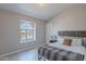 Comfortable bedroom with natural light from large window and stylish headboard at 1811 E Tierra Buena Ln, Phoenix, AZ 85022